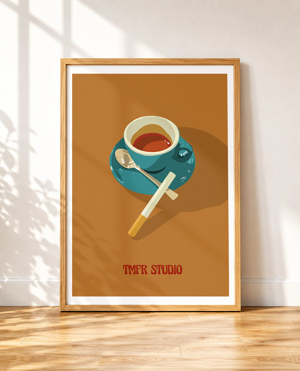 Framed Illustration of a coffee cup with a spoon and a cigarette resting on a saucer, on an orange background with TMFR Studio text
