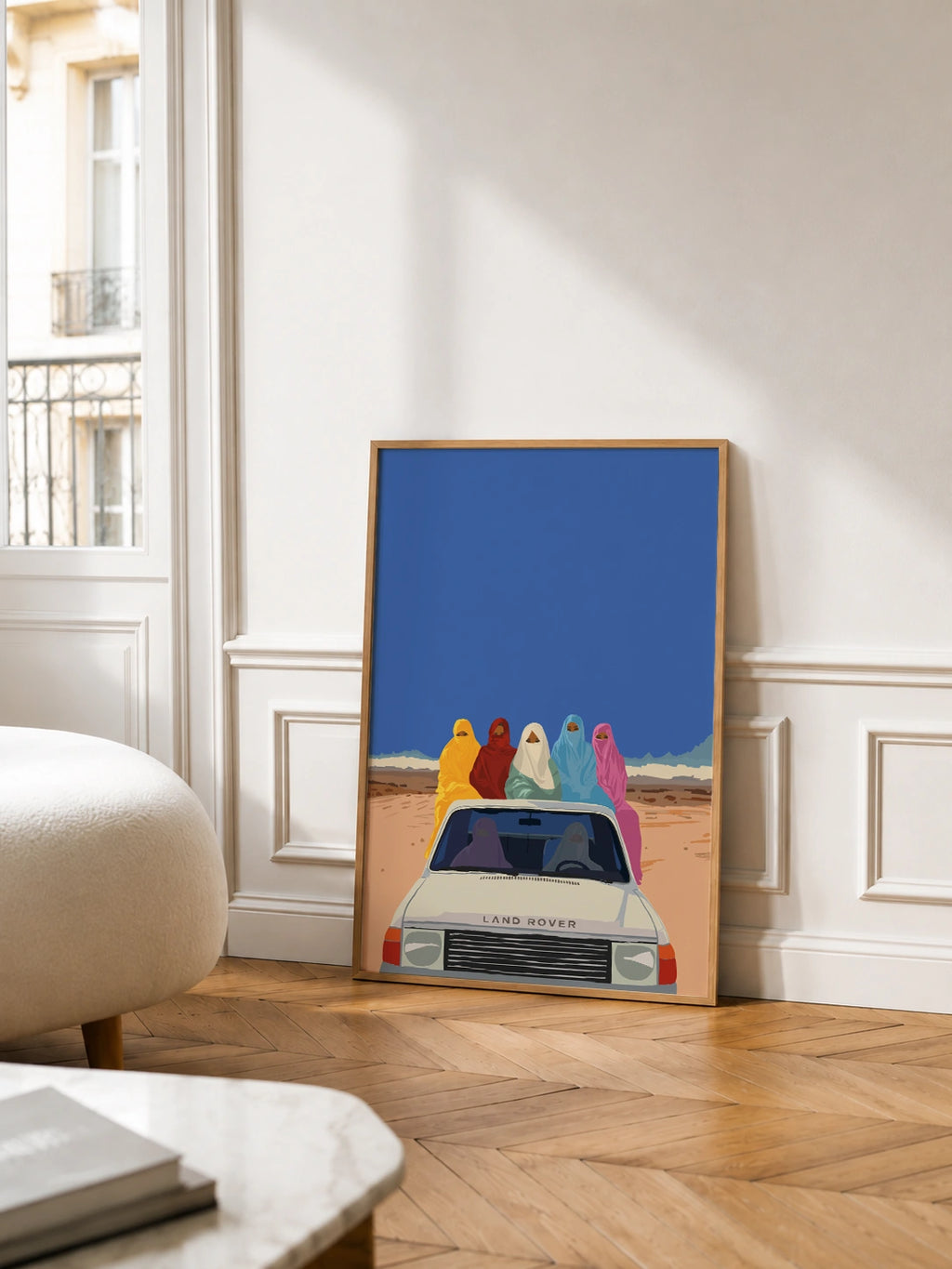 Colorful Arabic Women framed poster in a Parisian living room with wood paneling and a balcony view
