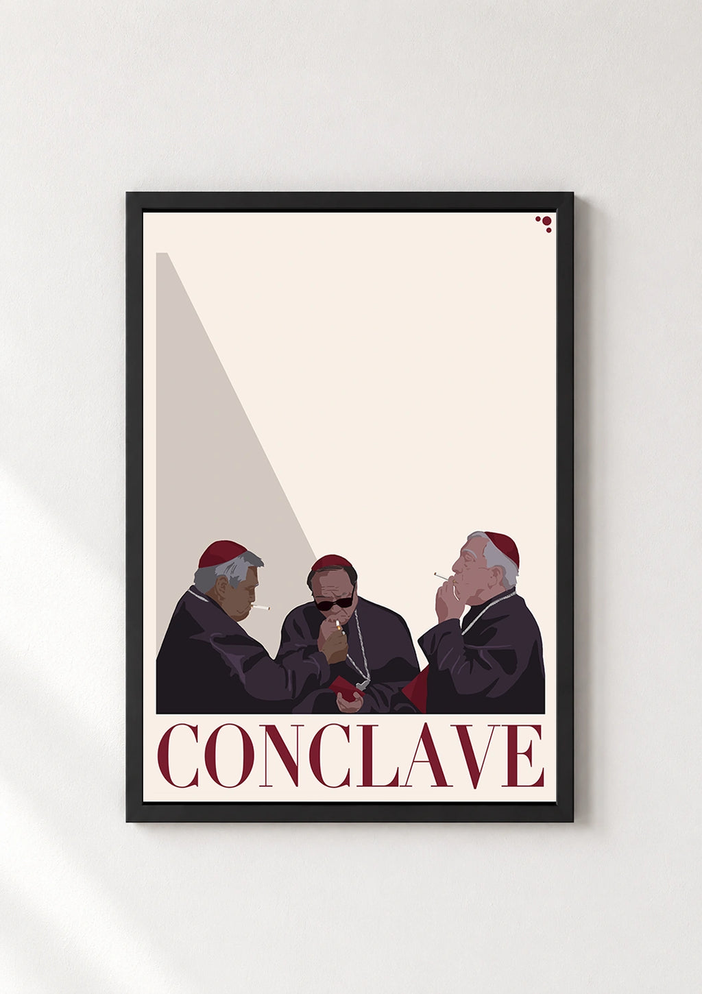 Conclave poster in a thin black frame displayed against a plain white wall
