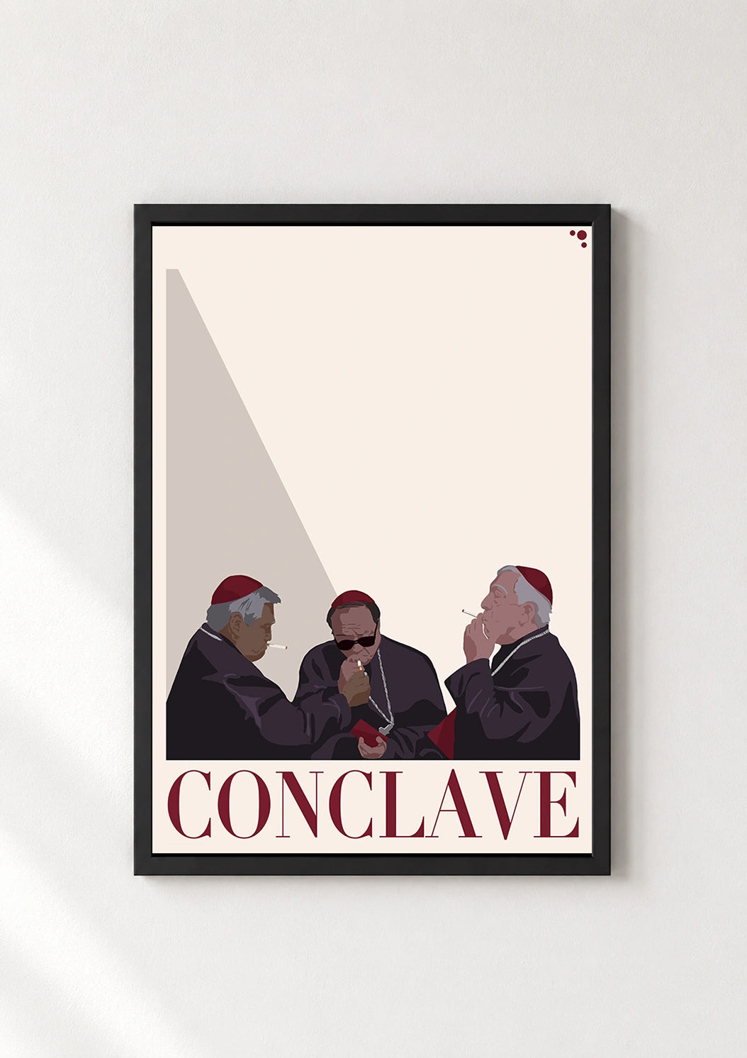 Conclave poster in a thin black frame displayed against a plain white wall
