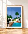 framed Illustration of a swimming pool surrounded by palm trees, white walls, and lounge chairs under a clear blue sky
