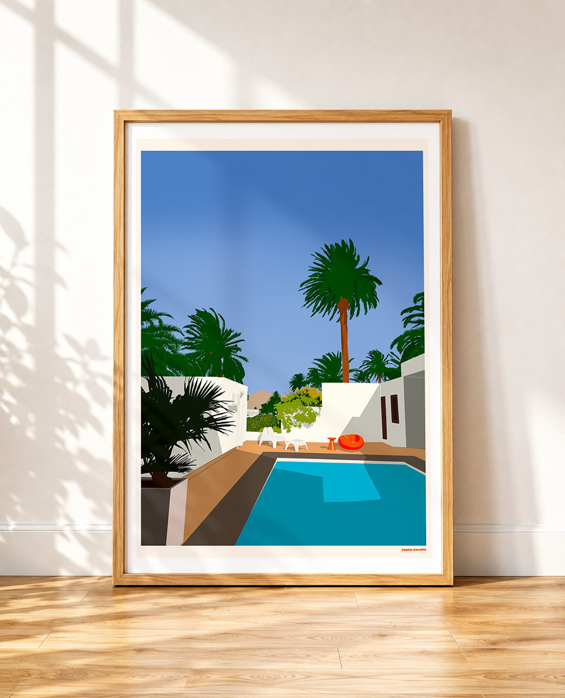 framed Illustration of a swimming pool surrounded by palm trees, white walls, and lounge chairs under a clear blue sky
