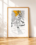framed Black and white line drawing of a cobblestone street scene with a stone fountain, a woman walking, a parked car and overhanging trees, with a bright orange sky breaking through the branches