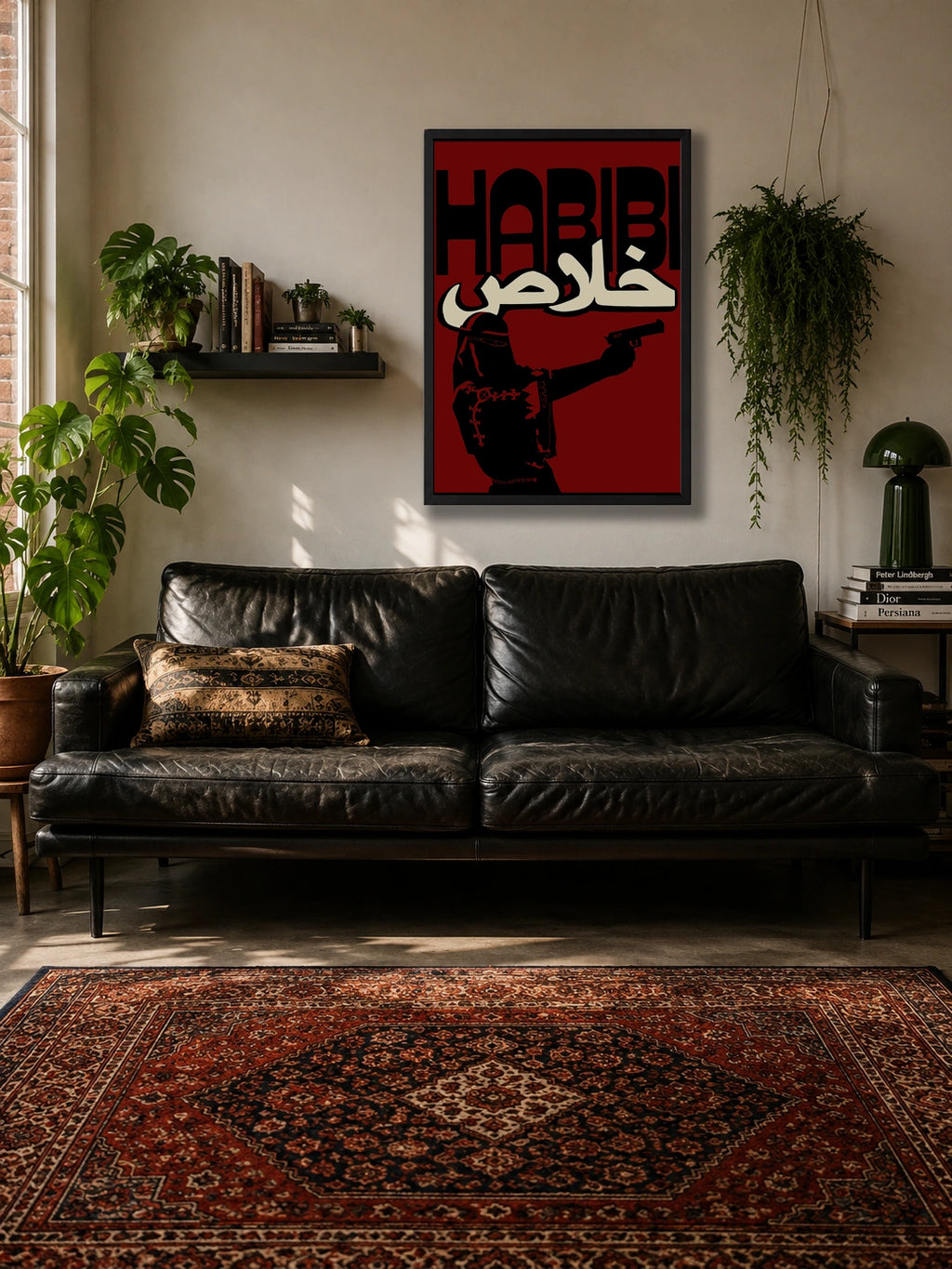 Habibi Khalas poster hanging above a black leather sofa with a patterned rug and plants
