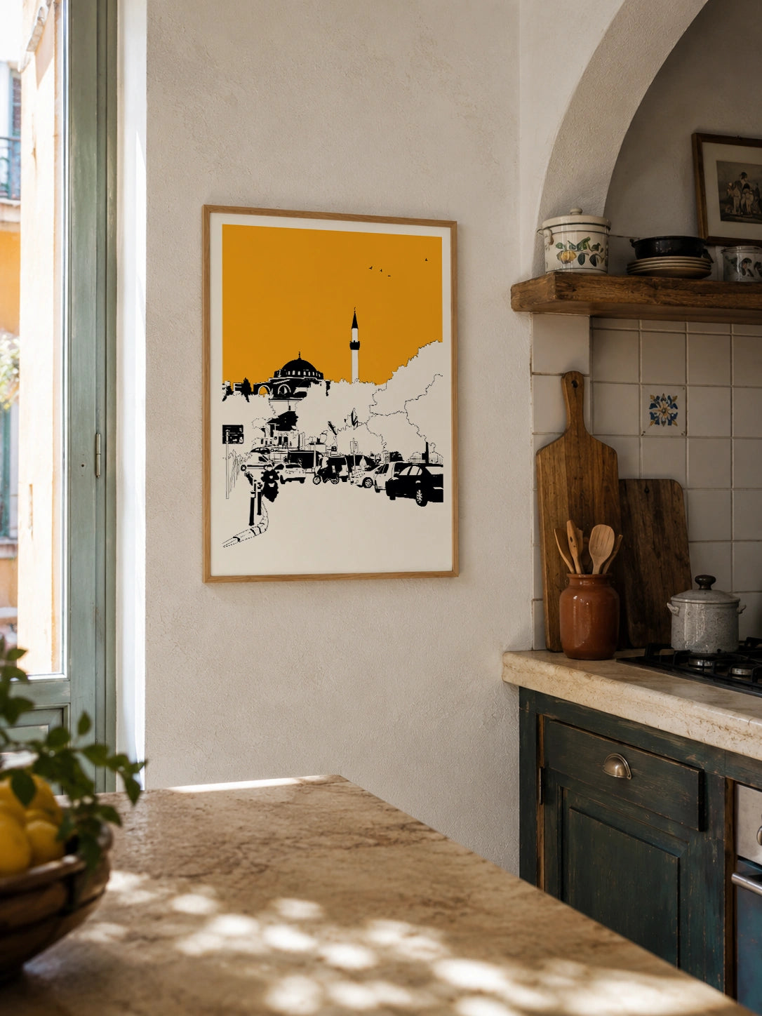 Istanbul street view framed poster hanging in a rustic kitchen with tiled backsplash and lemons
