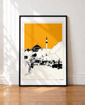 Black framed Istanbul mosque and minaret print with an orange sky leaning against a wall
