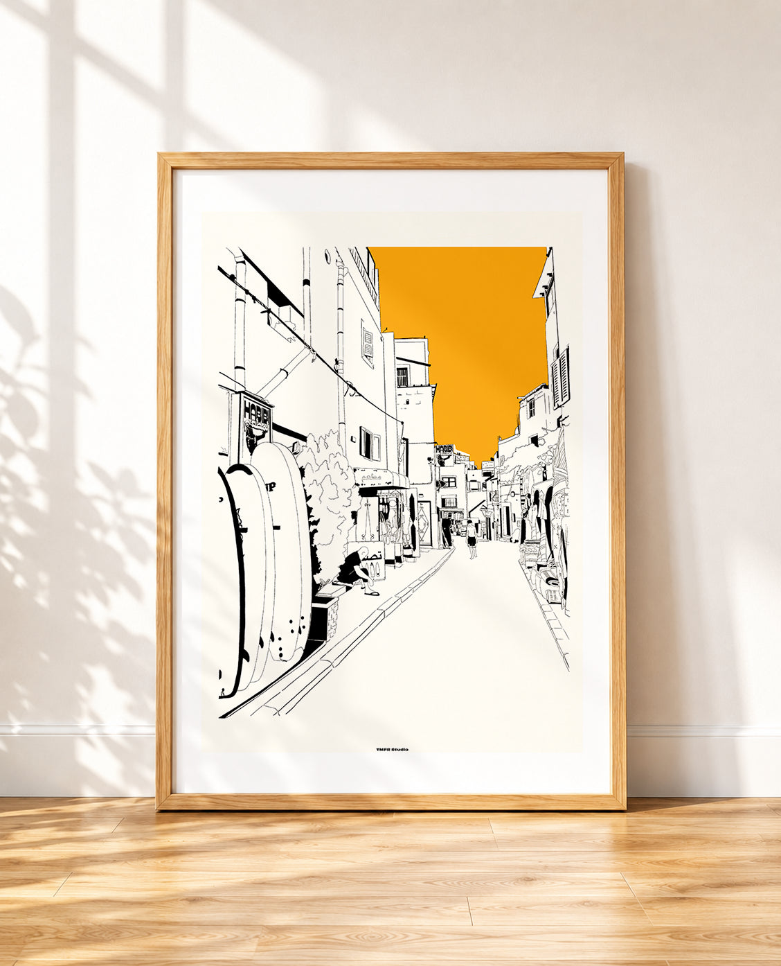 framed Taghazout street print with surfboards and an orange sky
