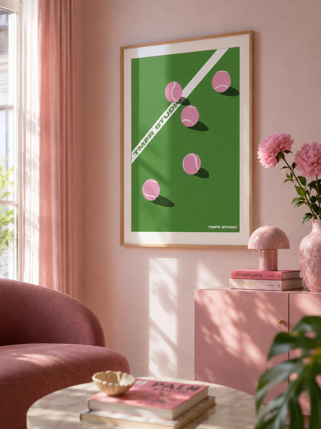 Pink tennis balls framed poster in a pink living room with flowers and a pink lamp
