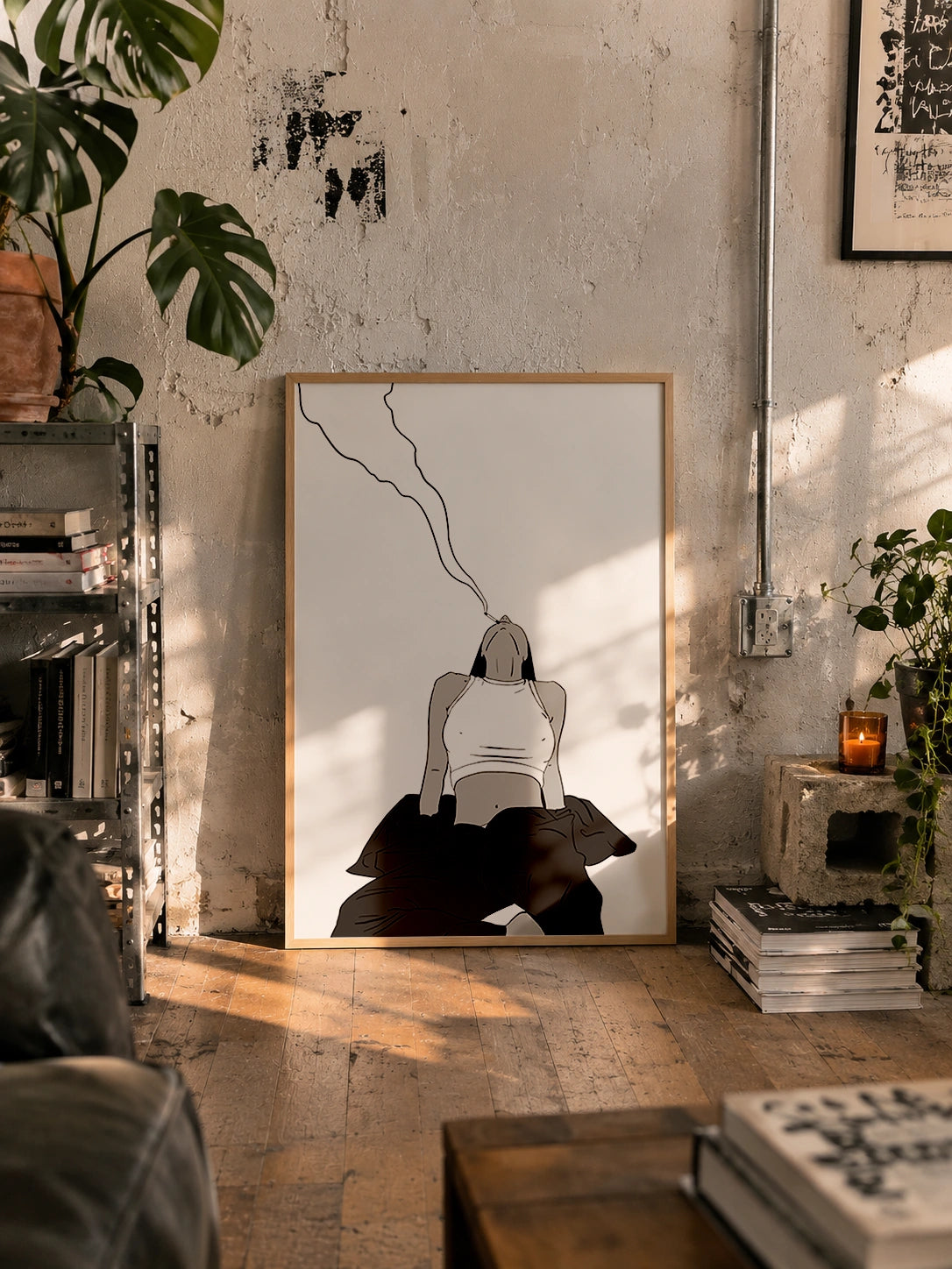 The Drag framed poster leaning against a wall in an industrial loft with plants and exposed pipes
