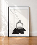 framed Black and white illustration of a woman with her head tilted back exhaling a wavy line of smoke, draped in dark fabric